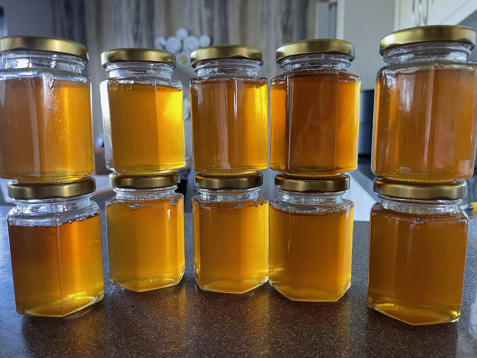 Honey jars stacked on each other for honey tasting